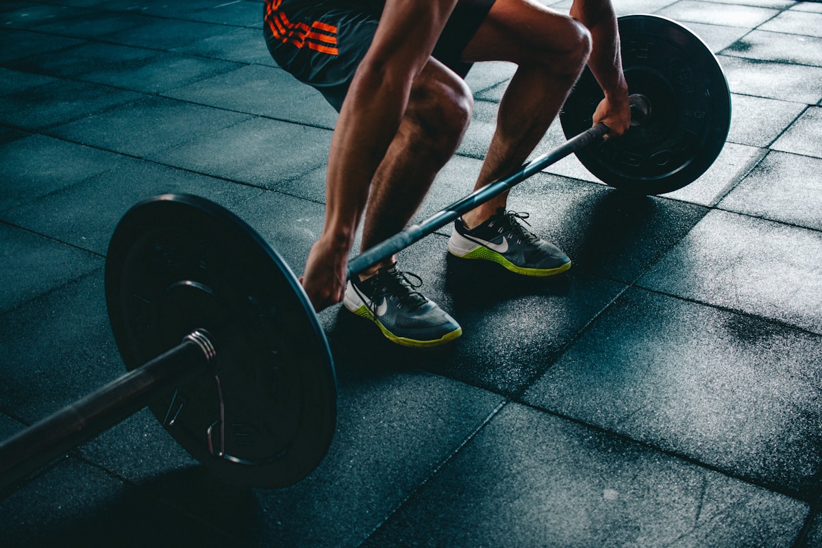 Athletes doing injury prevention warm-up exercises